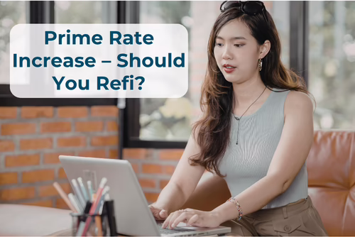 Prime Rate Increase Student Loan Refinance A woman sits typing at a laptop. The words "Prime Rate Increase - Should You Refi?" are overlaid at the top left.